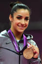 Bronze medalist <a href="http://sports.yahoo.com/olympics/gymnastics/alexandra-raisman-1134192/" data-ylk="slk:Alexandra Raisman;elm:context_link;itc:0;sec:content-canvas" class="link ">Alexandra Raisman</a> of the United States poses on the podium during the medal ceremony for the on Day 11 of the London 2012 Olympic Games at North Greenwich Arena on August 7, 2012 in London, England. (Photo by Michael Regan/Getty Images)