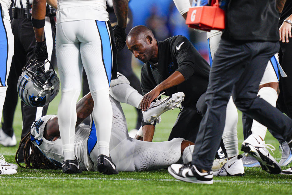 Carolina Panthers linebacker Shaq Thompson is treated on the field during the first half of an NFL football game against the New Orleans Saints Monday, Sept. 18, 2023, in Charlotte, N.C. (AP Photo/Jacob Kupferman)