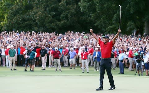 Tiger Woods makes par at the 18th at East Lake to win the Tour Championship, his 80th professional title and first since August 2013 - Credit: Tim Bradbury/Getty Images