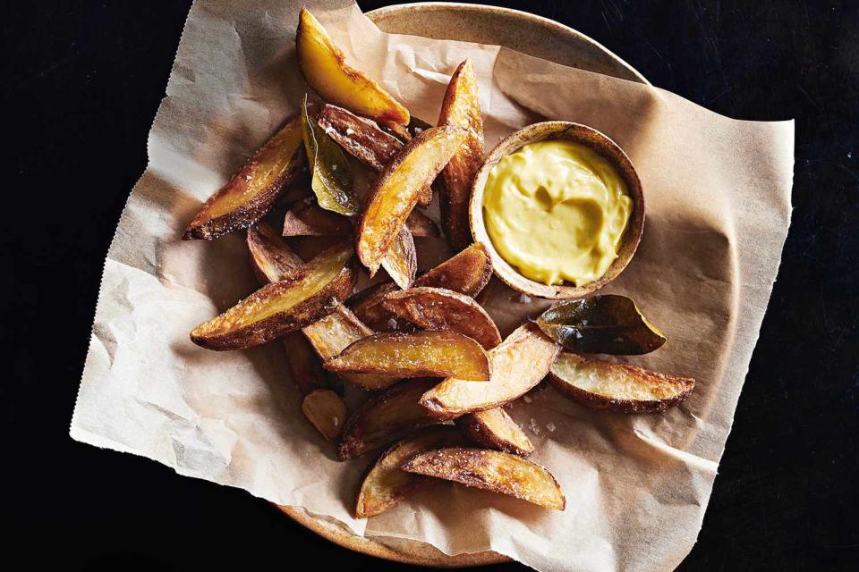 basket of olive-oil-fried potatoes with aioli