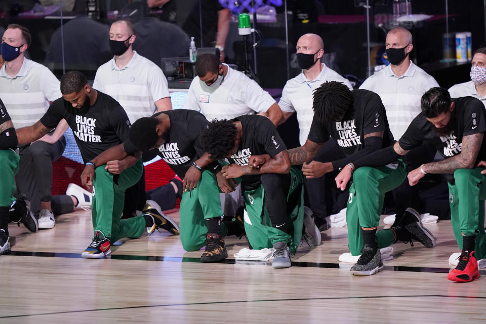 Boston Celtics kneel.
