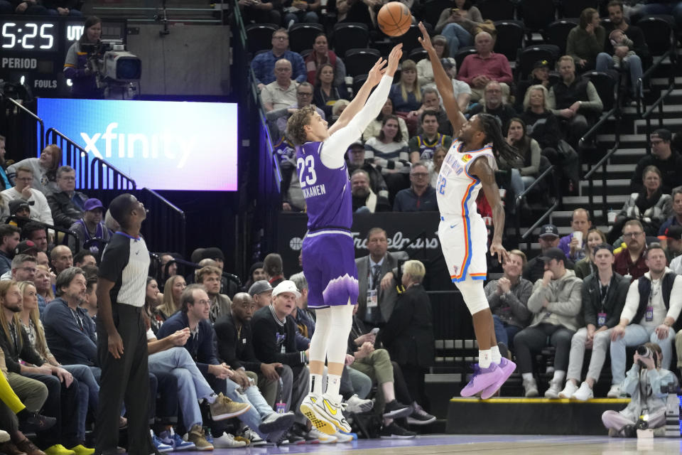 Oklahoma City Thunder guard Cason Wallace (22) defends against Utah Jazz forward Lauri Markkanen (23) during the first half of an NBA basketball game Thursday, Jan. 18, 2024, in Salt Lake City. (AP Photo/Rick Bowmer)