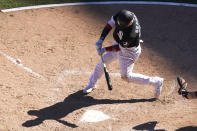 Chicago White Sox's Yasmani Grandal swings into a game-winning single off Tampa Bay Rays relief pitcher Pete Fairbanks during the 10th inning of a baseball game Wednesday, June 16, 2021, in Chicago. (AP Photo/Charles Rex Arbogast)