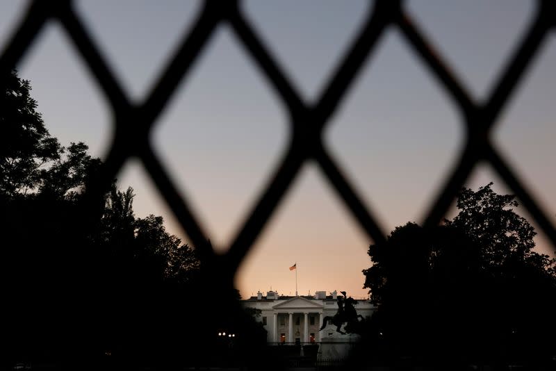 FILE PHOTO: The lights are on in the White House on a day that U.S. President Donald Trump has no scheduled public appearances while he continue fighting the coronavirus disease (COVID-19) in Washington