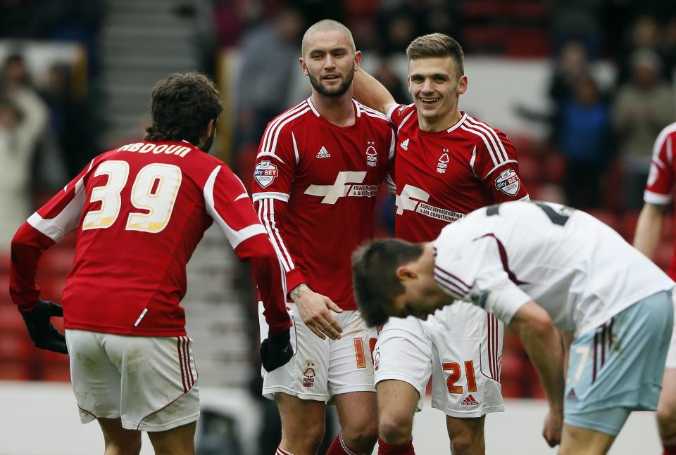 Nottingham Forest's Jamie Paterson (21) celebrates scoring against West Ham United during their FA Cup third round soccer match at City Ground in Nottingham January 5, 2014. REUTERS/Stefan Wermuth (BRITAIN - Tags: SPORT SOCCER)