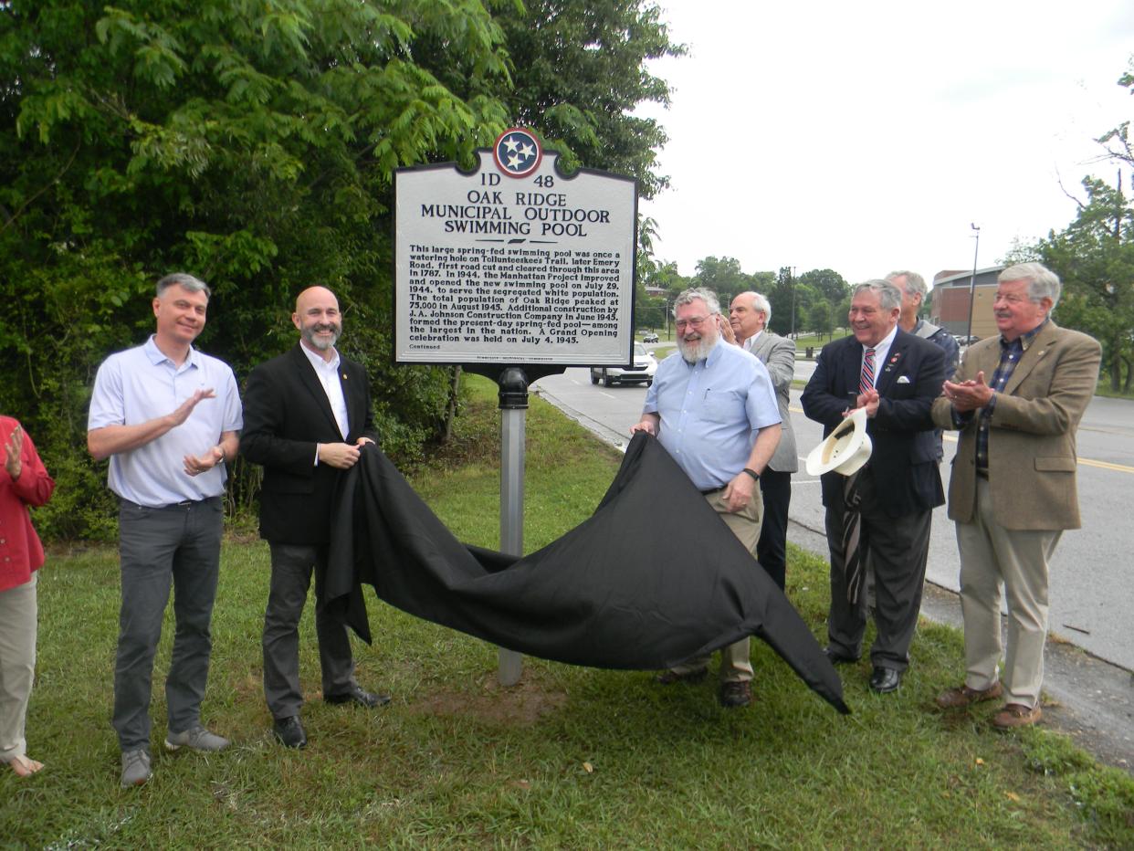 Officials unveil an Oak Ridge Municipal Outdoor Swimming Pool sign. Pictured are Mayor Pro Tem Rick Chinn, from left, Oak Ridge City Council member and Oak Ridge Heritage Preservation Association Board member Jim Dodson, Historically Speaking columnist D. Ray Smith, Tennessee Rep. John Ragan, R-Oak Ridge, and Lt. Gov. Randy McNally, R-Oak Ridge.