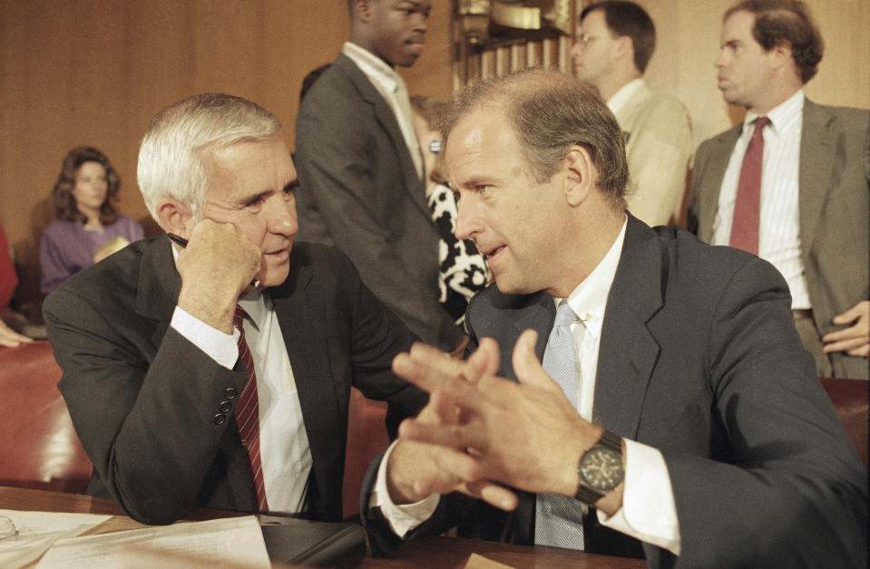 FILE - In this July 31, 1986, file photo Sen. Paul Laxalt, R-Nev., left, and Sen. Joseph Biden, Jr., D-Del., meet prior to a Senate Judiciary Committee confirmation hearing at Capitol Hill in Washington. The panel was meeting to install William Rehnquist as chief justice of the United States. (AP Photo/Lana Harris, File)