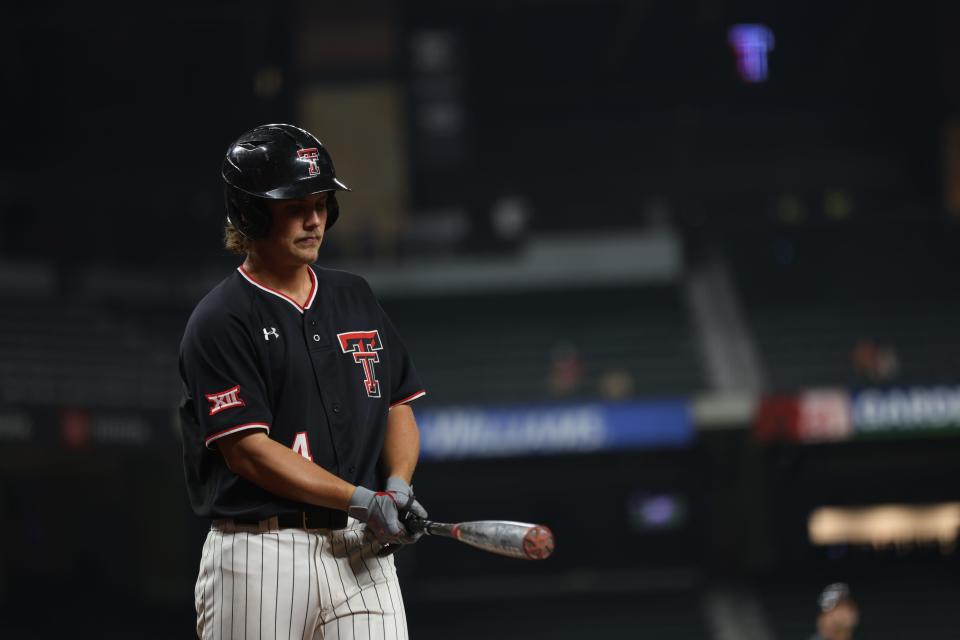 Texas Tech’s Kevin Bazzell (4) prepares to go to the batter’s box during a second-round game Thursday, May 25, 2023, against Oklahoma in the Big 12 Tournament at Globe Life Field in Arlington, Texas. Bazzell recorded the game-winning hit in the ninth inning to give the Red Raiders a 10-9 win.