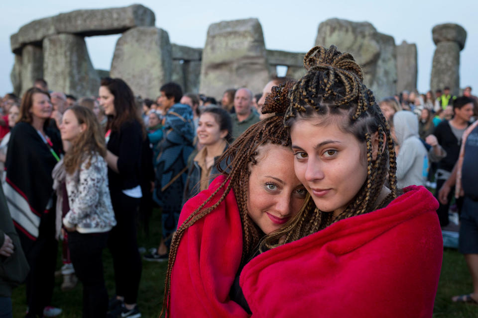 <p>Spiritual revellers celebrate the summer solstice (mid-summer and longest day) at the ancient stones of Stonehenge, on 21st June 2017, in Wiltshire, England. (Photo: Richard Baker/In Pictures via Getty Images) </p>