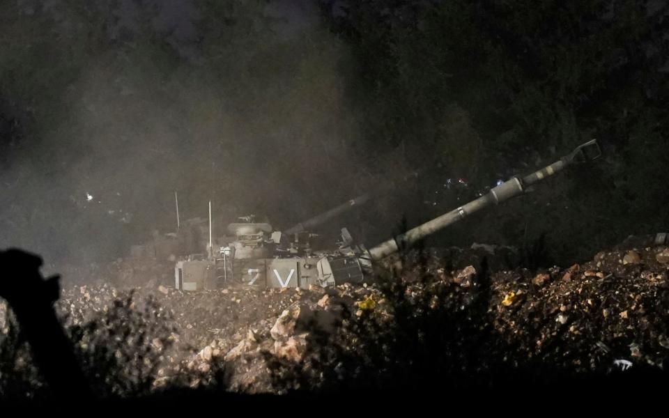 An Israeli artillery unit fires towards Lebanon from a position near the border