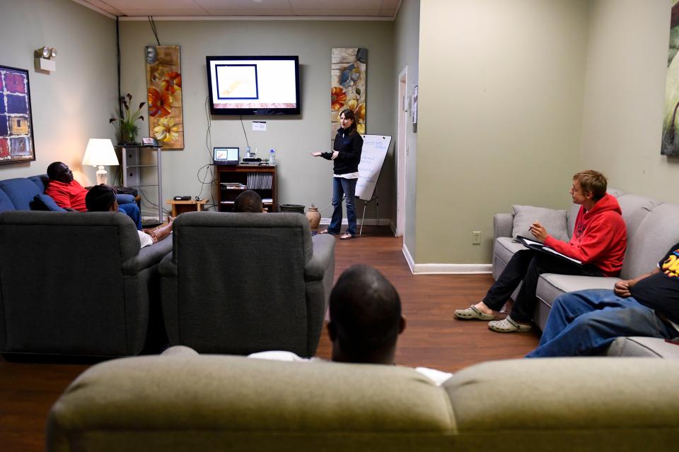 Soteria House residents attend a financial literacy class at the house on Monday, April 10, 2023. Residents are required to attend classes to build a foundation of knowledge for when they graduate from the program.