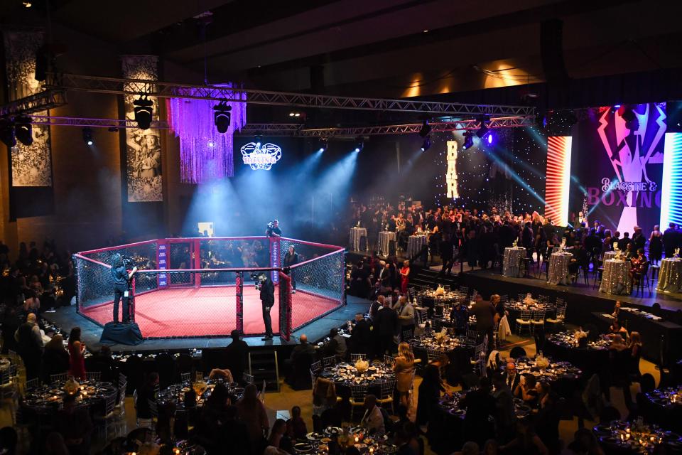 Attendees chat as they wait for the first fight of the night during the 2024 'Black Tie & Boxing' Charity Event inside Carl Perkins Civic Center in Jackson, Tenn., on Saturday, Jan. 13, 2024.