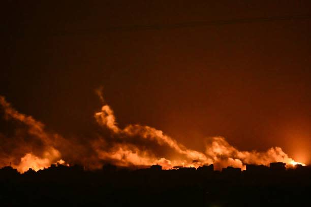 This picture taken from a position near Sderot along the Israeli border with the Gaza Strip on 5 November 2023, shows flares dropped by Israeli forces above the Palestinian enclave amid ongoing battles between Israel and the Palestinian Hamas movement (AFP via Getty Images)