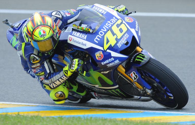 Italian motorcycling legend Valentino Rossi competes on his Movistar Yamaha MotoGP N°46 during the qualifying practice session on May 16, 2015 in Le Mans, France