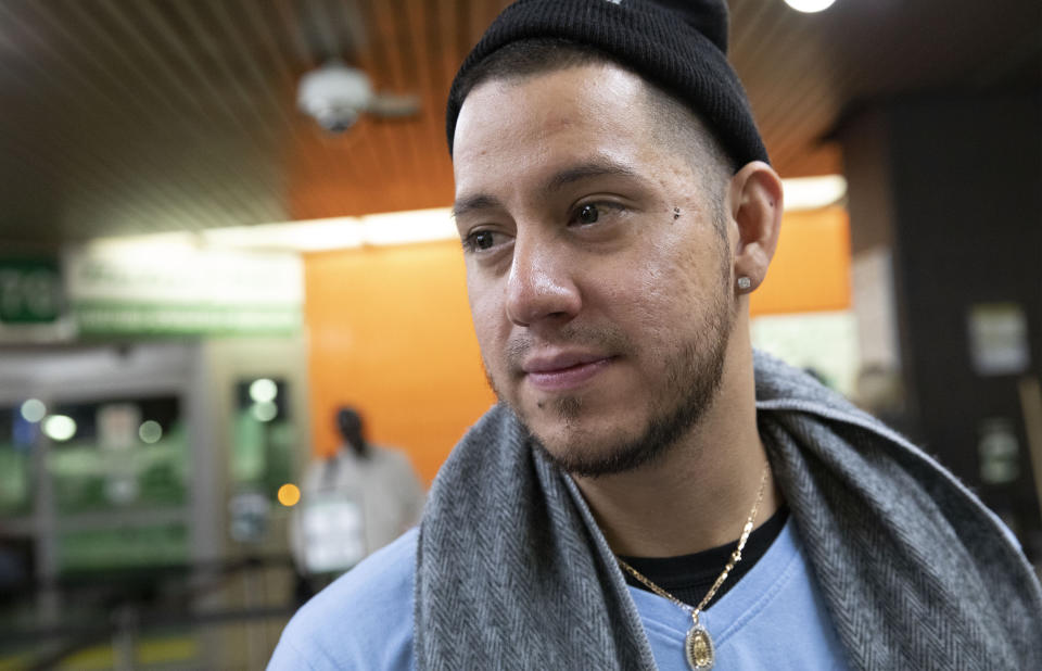 Martín Batalla Vidal waits in line at the Port Authority Bus Terminal in New York to take a bus to Washington, Monday, Nov. 11, 2019. Vidal is a lead plaintiff in one of the cases to preserve the Obama-era program known as Deferred Action for Childhood Arrivals and has seen his name splashed in legal documents since 2016, when he first sued in New York. His case will be heard at the Supreme Court beginning Tuesday. (AP Photo/Mark Lennihan)