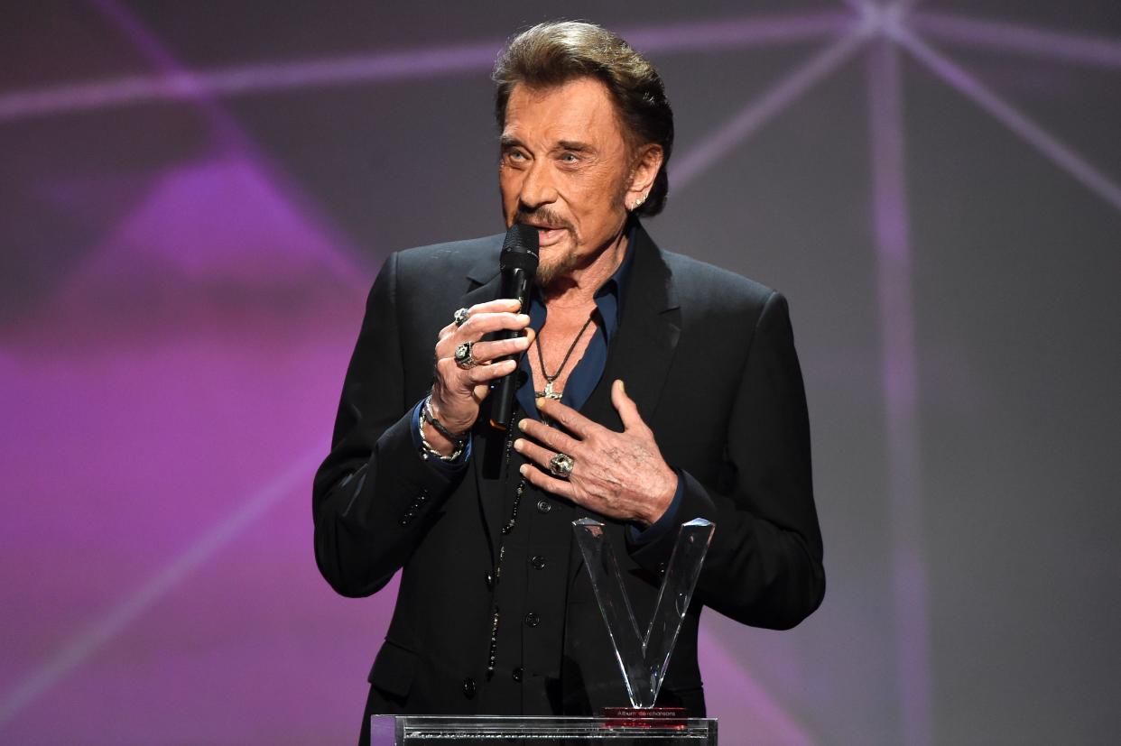 French singer Johnny Hallyday speaks as he receives the best album award  on stage during the 31st Victoires de la Musique, the annual French music awards ceremony, on February 12, 2016 at the Zenith concert hall in Paris.  / AFP / BERTRAND GUAY        (Photo credit should read BERTRAND GUAY/AFP/Getty Images)