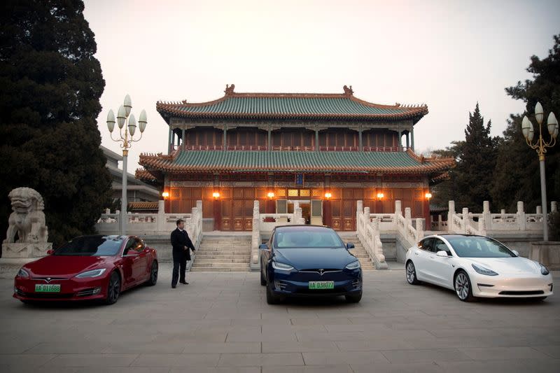 FILE PHOTO: Tesla vehicles are parked outside of a building at the Zhongnanhai leadership compound during a meeting between Tesla CEO Elon Musk and Chinese Premier Li Keqiang in Beijing