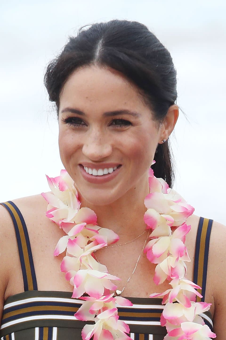 Meghan wearing a ponytail on the beach in 2018