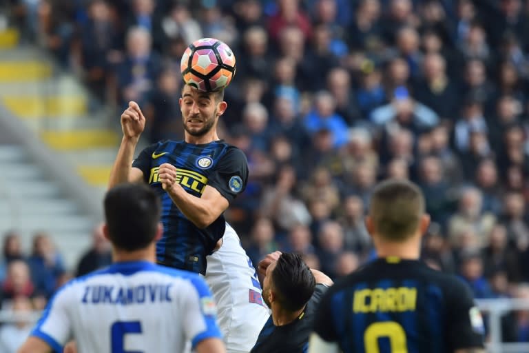 Inter Milan's midfielder Roberto Gagliardini heads the ball during the Italian Serie A football match Inter Milan vs Atalanta at "San Siro" Stadium in Milan on March 12, 2017