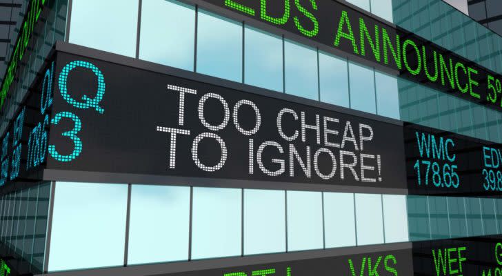 a computer rendering of an LED sign on a building saying "Too cheap to ignore" representing cheap stocks