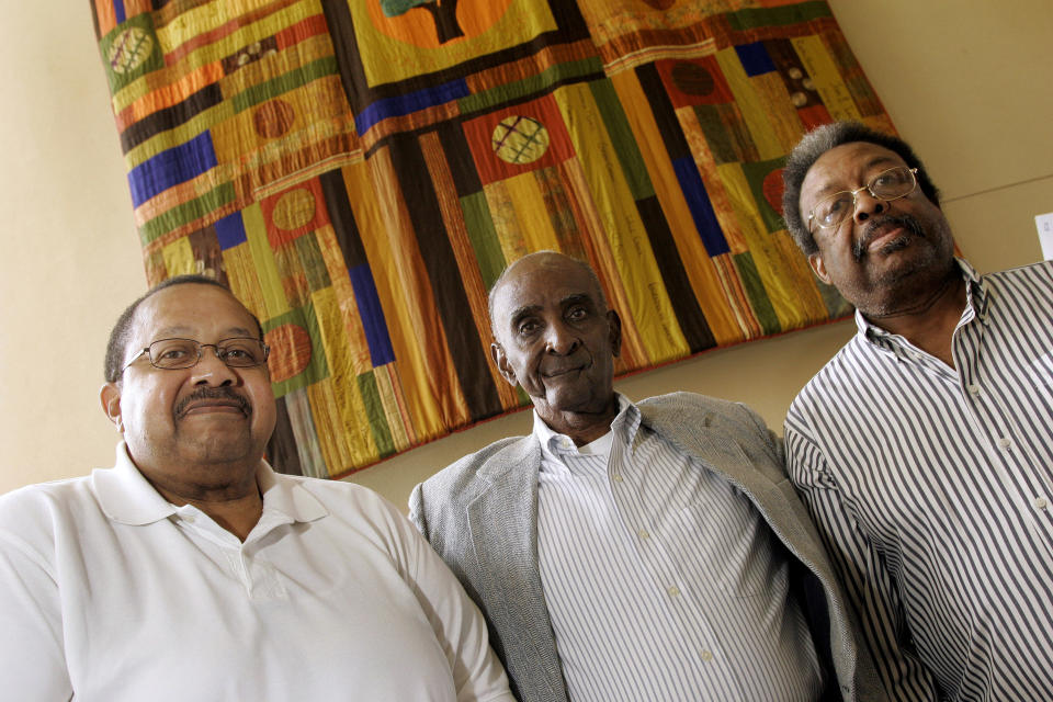 FILE - In this Friday, Sept. 17, 2010 photo, from left, Ralph Frasier, John Lewis Brandon, center, and LeRoy Frasier, the first black undergraduate students at the University of North Carolina at Chapel Hill, in the 1950's, pose for photographs in Chapel Hill, N.C. Ralph Frasier, the final surviving member of a trio of African American youths who were the first to desegregate the undergraduate student body at North Carolina's flagship public university in the 1950s, died May 8, 2024, at age 85 at the Mayo Clinic in Jacksonville, Fla., according to son Ralph Frasier Jr. (AP Photo/Jim R. Bounds, File)