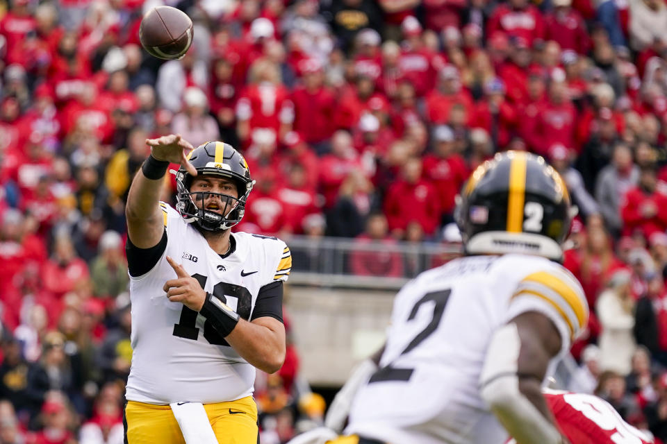 Iowa quarterback Deacon Hill (10) throws against Wisconsin during the first half of an NCAA college football game Saturday, Oct. 14, 2023, in Madison, Wis. (AP Photo/Andy Manis)