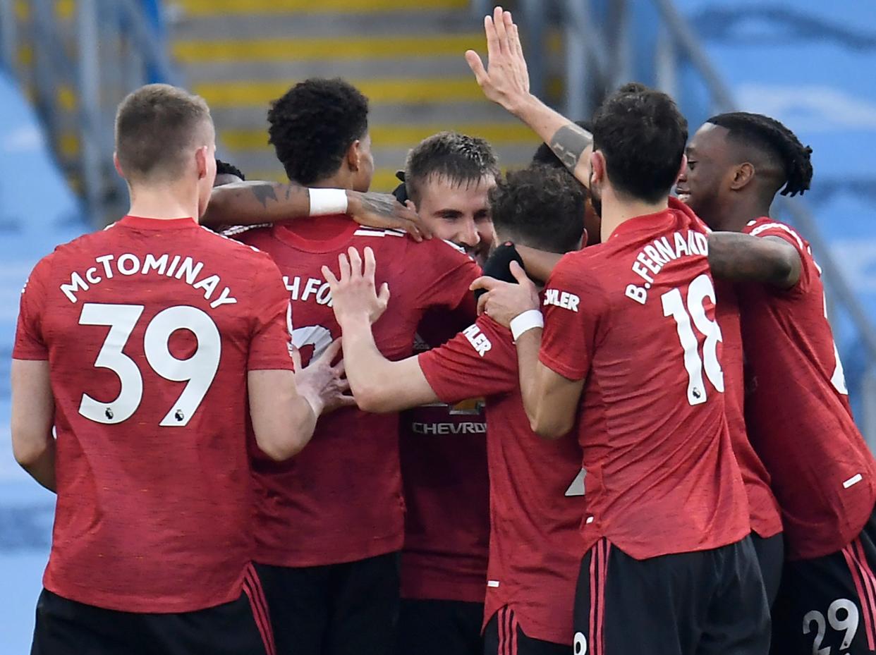 <p>Manchester United celebrate Luke Shaw’s goal</p> (POOL/AFP via Getty Images)