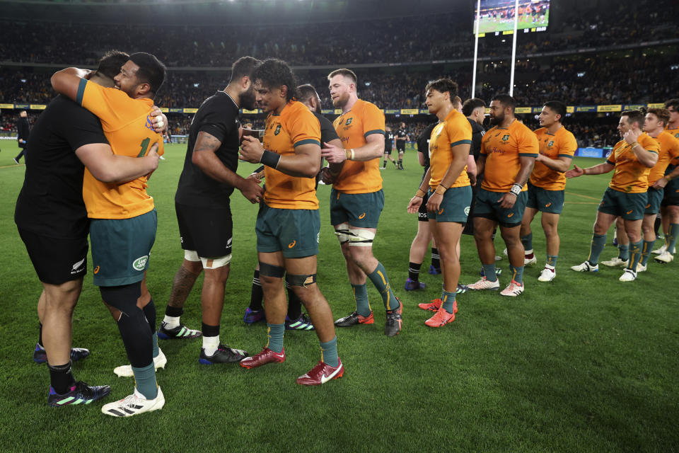 New Zealand and Australian players shake hands after New Zealand won their Bledisloe Cup rugby test match in Melbourne, Australia, Thursday, Sept 15, 2022. (AP Photo/Asanka Brendon Ratnayake)