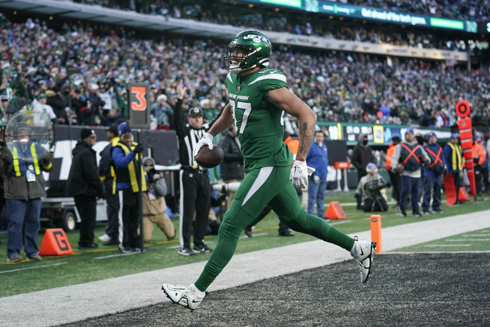New York Jets tight end C.J. Uzomah (87) celebrates his second touchdown of the game against the Detroit Lions during the fourth quarter of an NFL football game, Sunday, Dec. 18, 2022, in East Rutherford, N.J. (AP Photo/Seth Wenig)