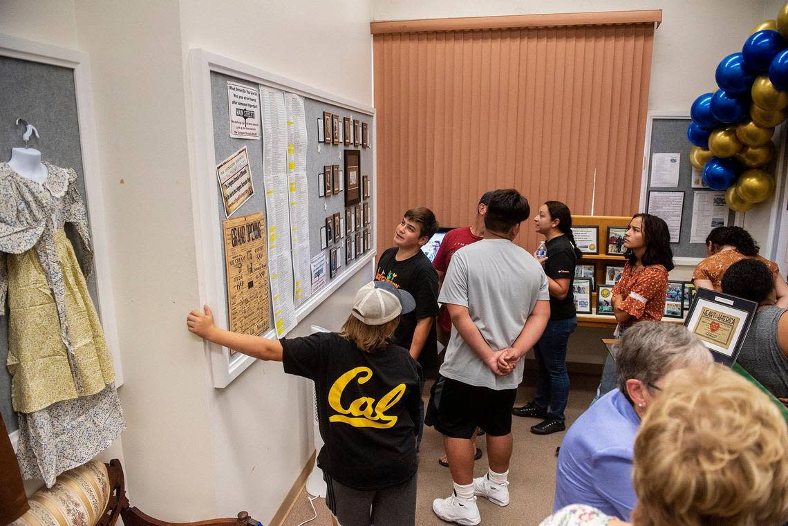 People walk through the centennial exhibit inside the Livingston Historical Museum during the city’s centennial celebration in Livingston, Calif., on Sunday, Sept. 11, 2022.