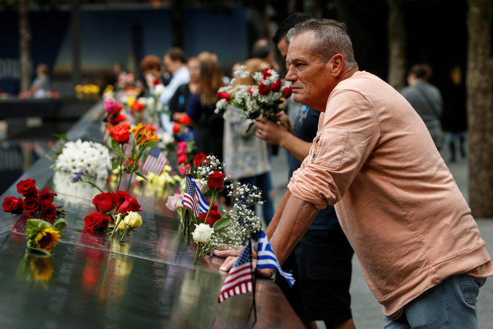 <p>Guests visits the National 9/11 Memorial during ceremonies marking the 17th anniversary of the September 11, 2001 attacks on the World Trade Center, at the National 9/11 Memorial and Museum in New York, Sept. 11, 2018. (Photo: Brendan McDermid/Reuters) </p>