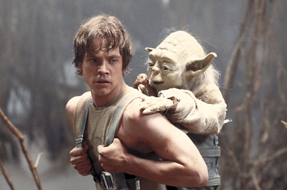FILE - This 1980 publicity image originally released by Lucasfilm Ltd., Mark Hamill as Luke Skywalker and the character Yoda appear in this scene from “Star Wars Episode V: The Empire Strikes Back.” (AP Photo/Lucasfilm Ltd)