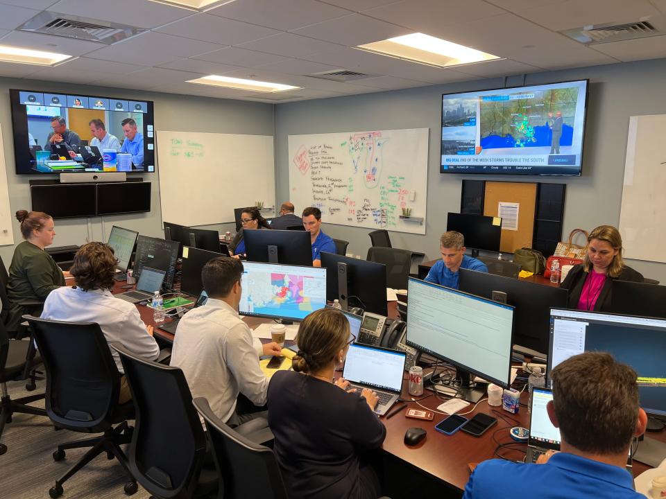 In this May 12, 2022 photo, Florida Power & Light employees practice addressing a made-up storm named Hurricane Constantine during a storm drill in Riviera Beach.