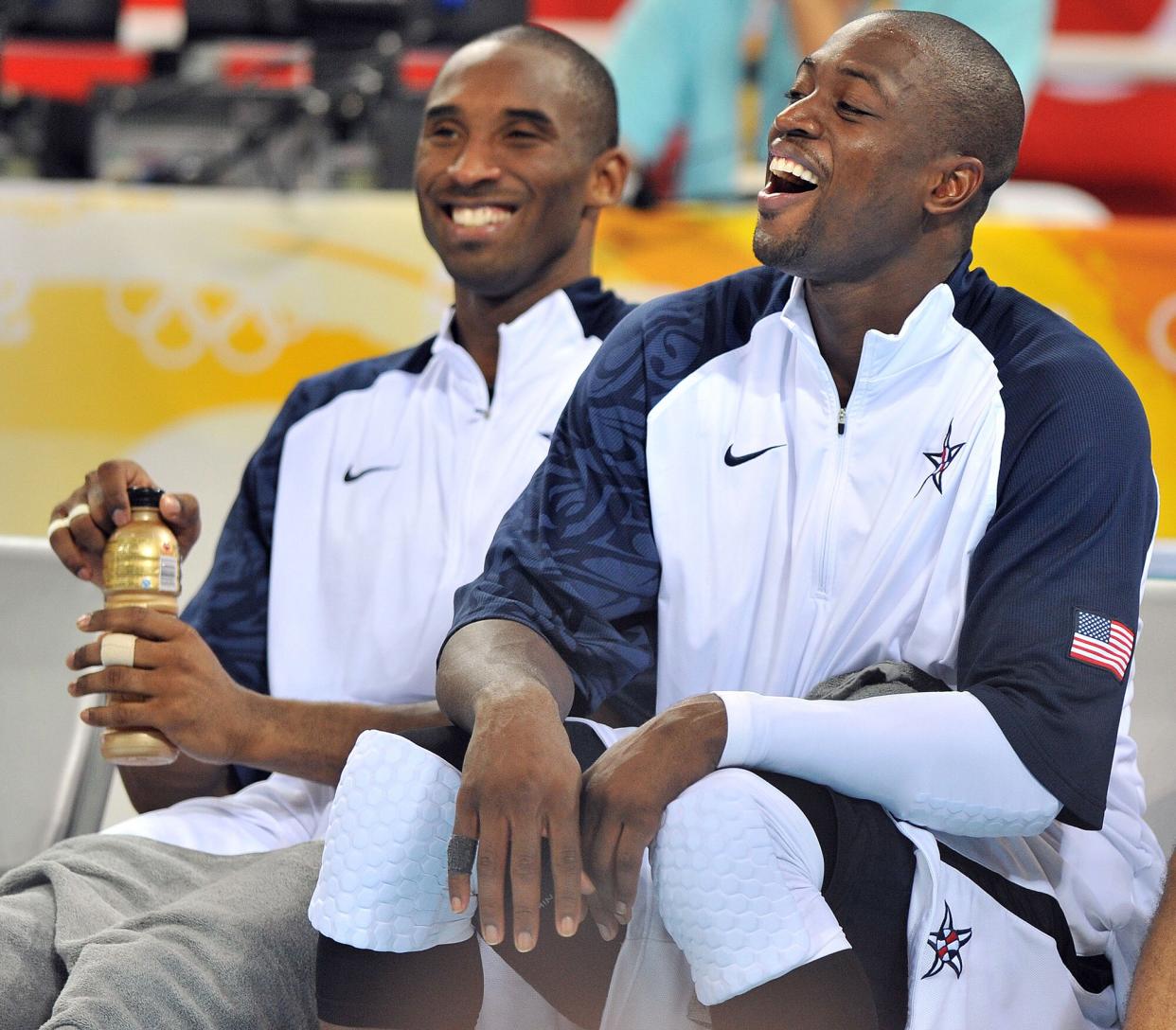 USA's Kobe Bryant, left and Dwyane Wade have a laugh on the bench in the 4th quarter of their opening round contest at Olympic Basketball Stadium in the Games of the the XXIX Olympiad in Beijing, China. USA defeated China 101-70.