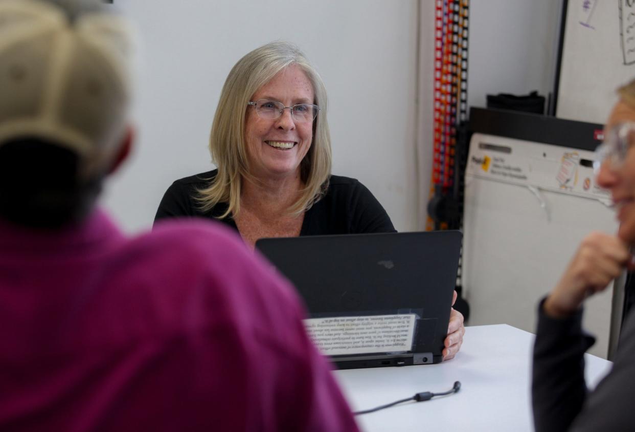 Cheryl Smith, enterprise and investigations editor, speaks with her team members in TCPalm’s Fort Pierce office.