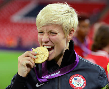 FILE PHOTO: Megan Rapinoe of the U.S. celebrates after defeating Japan in the women's final soccer match at the London 2012 Olympic Games in London at Wembley Stadium, August 9, 2012. REUTERS/Nigel Roddis/File Photo