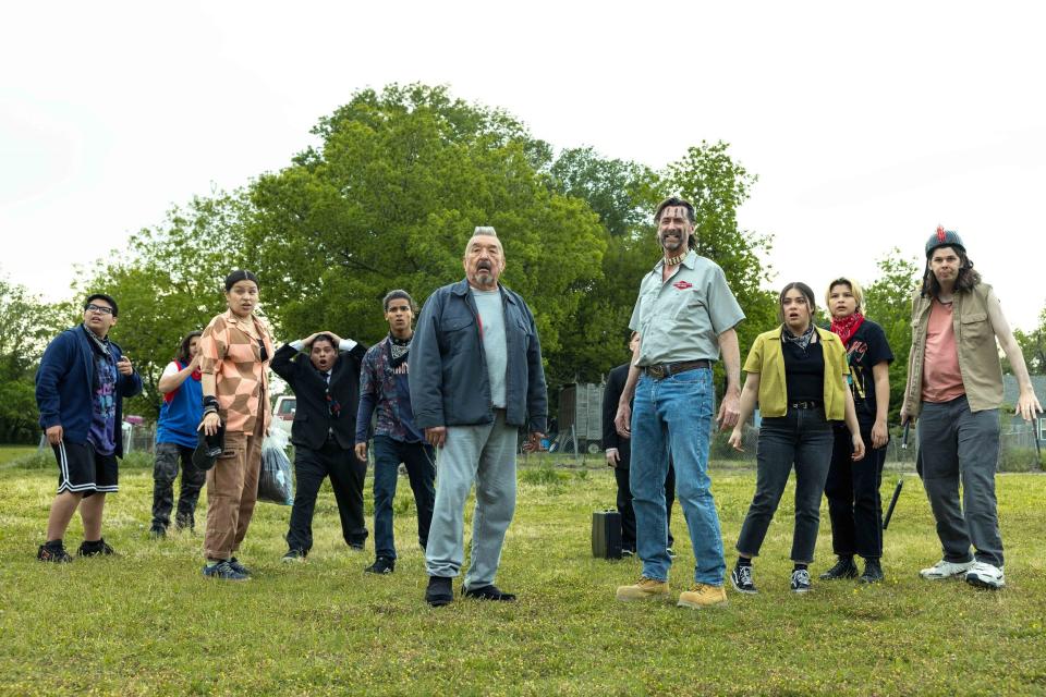 From left, Lane Factor stars as Cheese, Xavier Bigpond as Weeze, Paulina Alexis as Willie Jack, Jude Barnett as Bone Thug Dog, D’Pharaoh Woon-A-Tai as Bear, Graham Greene as Maximus, Kirk Fox as Kenny Boy, Devery Jacobs as Elora Danan, Elva Guerra as Jackie and  Matty Cardarople as Ansel in "Reservation Dogs" Season 3, Episode 8, titled "Send It."