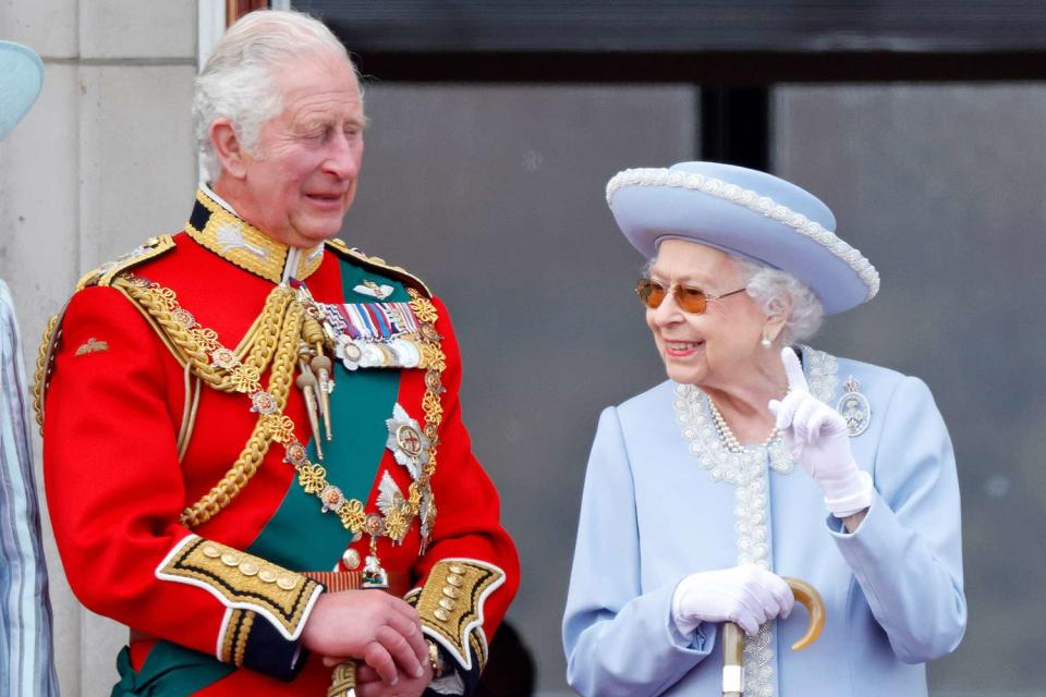 <p>Max Mumby/Indigo/Getty</p> Then-Prince Charles and Queen Elizabeth on the balcony of Buckingham Palace for Trooping the Colour in June 2022.