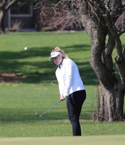 Roland-Story's Ellie Erickson chips a shot onto the green during one of the meets for the Norse girls golf team last week.