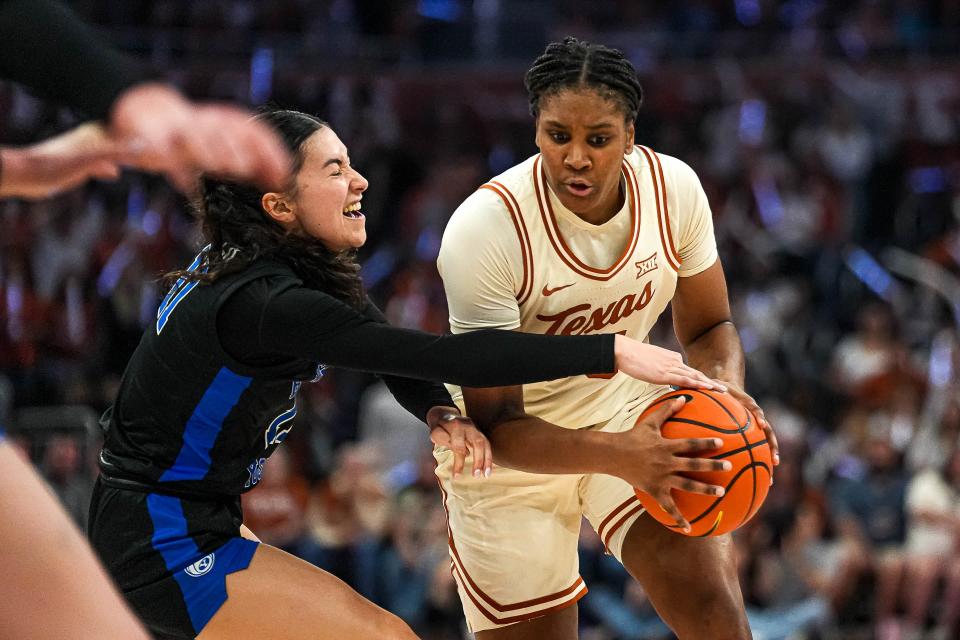 Texas freshman Madison Booker protects the ball from BYU guard Kaylee Smiler during their game March 2 at Moody Center. Booker, the Big 12 co-player of the year, leads the Longhorns into this week's NCAA Tournament.