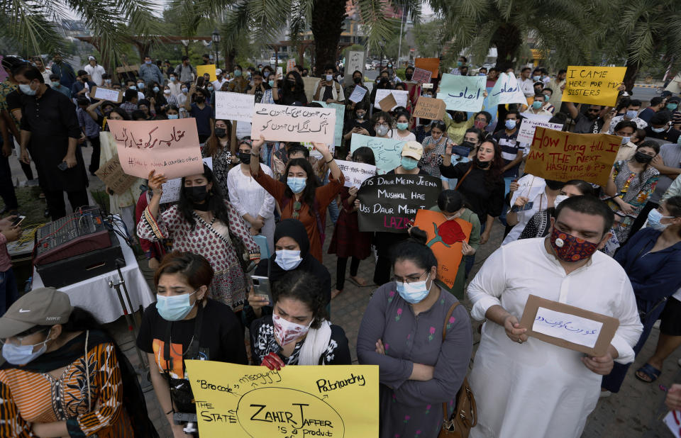 Women's rights activist take part in a demonstration to condemn the violence against women, in Lahore, Pakistan, Saturday, July 24, 2021. The beheading of a young woman in an upscale neighborhood of Pakistan's capital has shone a spotlight on the relentless violence against women in the country. Rights activists say such gender-based assaults are on the rise as Pakistan barrels toward greater religious extremism. (AP Photo/K.M. Chaudhry)