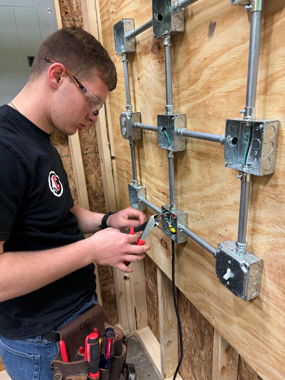 A student works on wiring during the electrical systems technology program at the Coshocton County Career Center. Completion of the program gives first year credit for the Newark Electrical Apprenticeship Program.