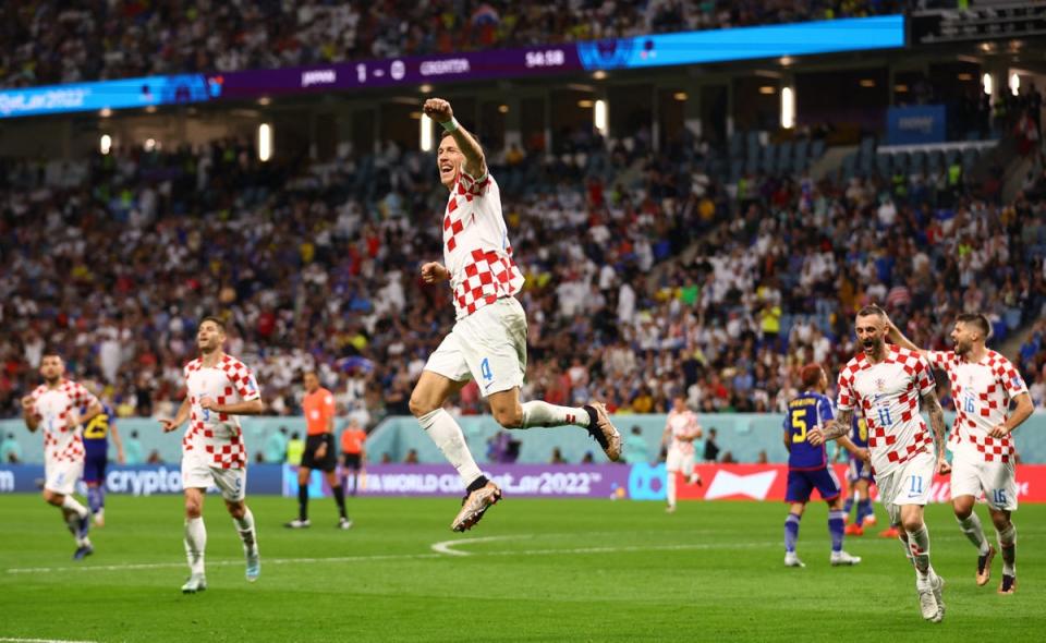 Ivan Perisic celebrates scoring Croatia’s equaliser against Japan (REUTERS)