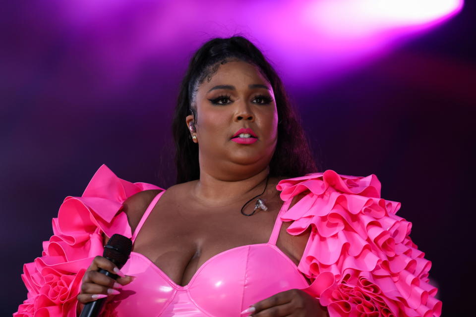 Lizzo holding a microphone