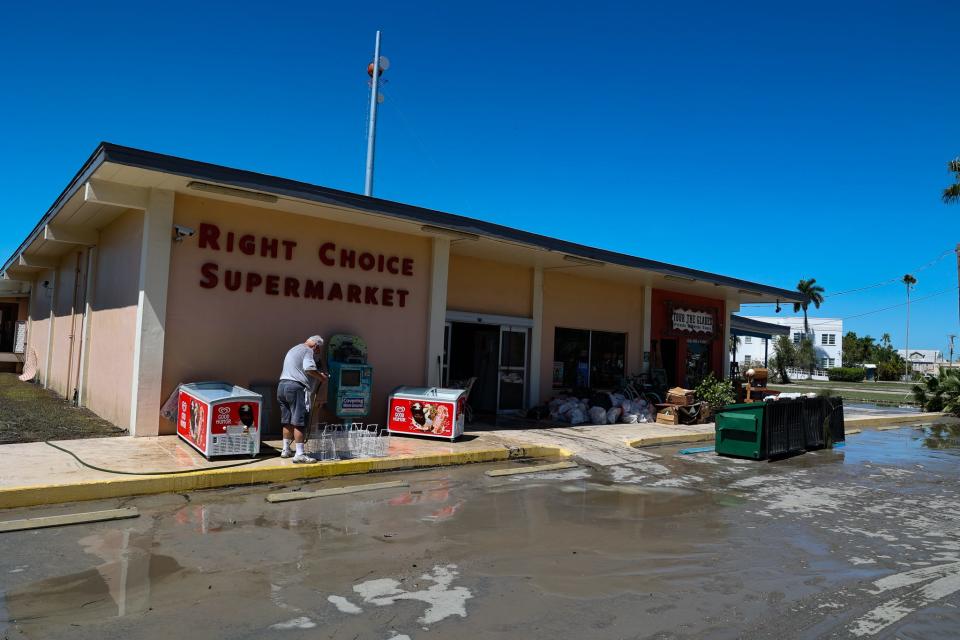 Residents and business owners of Everglades City clean up from Hurricane Ian.