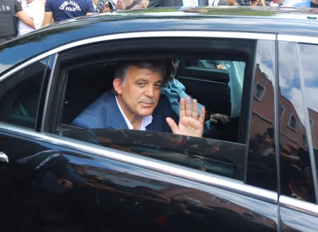 FILE PHOTO: Former Turkish President Gul waves from a car in Istanbul