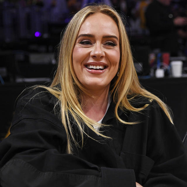 Adele wows in double denim and heels for date night at NBA game