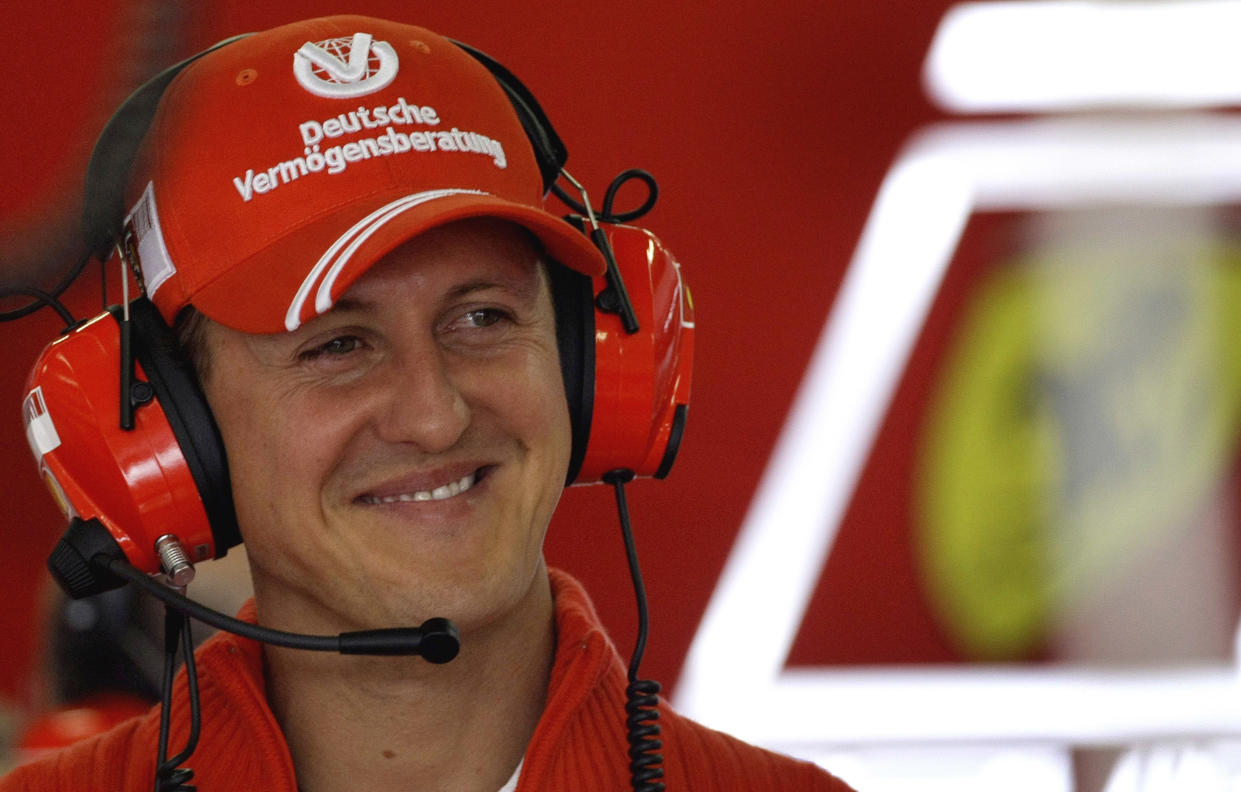 Ferrari's former World Champion and now team representative, Michael Schumacher smiles inside the pit during the first free practice at the Nuerburgring race track July 20, 2007. (Reuters)