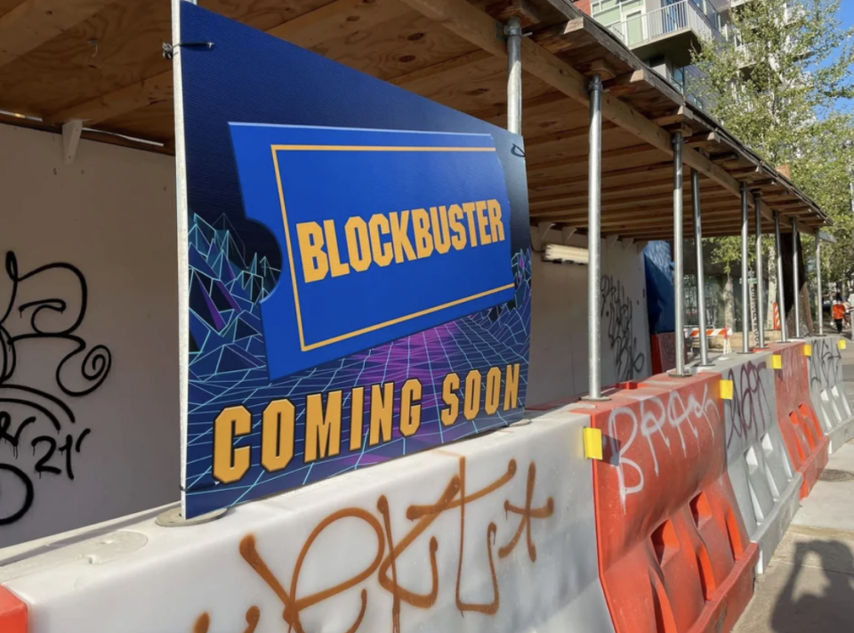 "Blockbuster coming soon" sign on scaffolding
