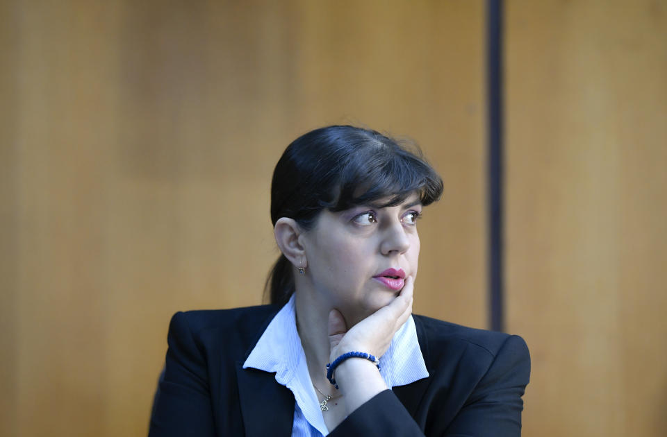 In this photo taken on Friday, Oct. 4, 2019, Laura Codruta Kovesi, Romania's former chief anti-corruption prosecutor who will direct the European Public Prosecutor's Office (EPPO) - tasked with investigating fraud connected to the use of EU funds and other financial crimes, speaks during an interview with the Associated Press, in Bucharest, Romania. For Kovesi, opposition to her successful candidacy to become the European Union’s first chief prosecutor came from a familiar source - her own country’s government. Kovesi spent five years as head of the Romanian Anticorruption Directorate and those indicted by her office included 14 Cabinet members, 53 lawmakers and a member of the European Parliament. (AP Photo/Andreea Alexandru)